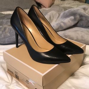 Black leather pumps